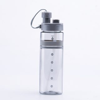 Transparent 700ml plastic water bottle with built-in straw and measurement markings